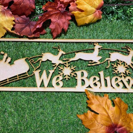 We Believe Sign with Sleigh